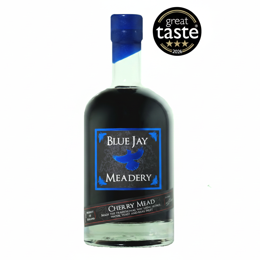 A bottle of Blue Jay Meadery Cherry Mead with a dark label and blue cap, shown on a white background with a 'great taste 2026' award badge in the top right corner.